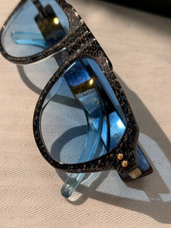 Backlit YerryNow One showing the carbon weave and blue lenses
